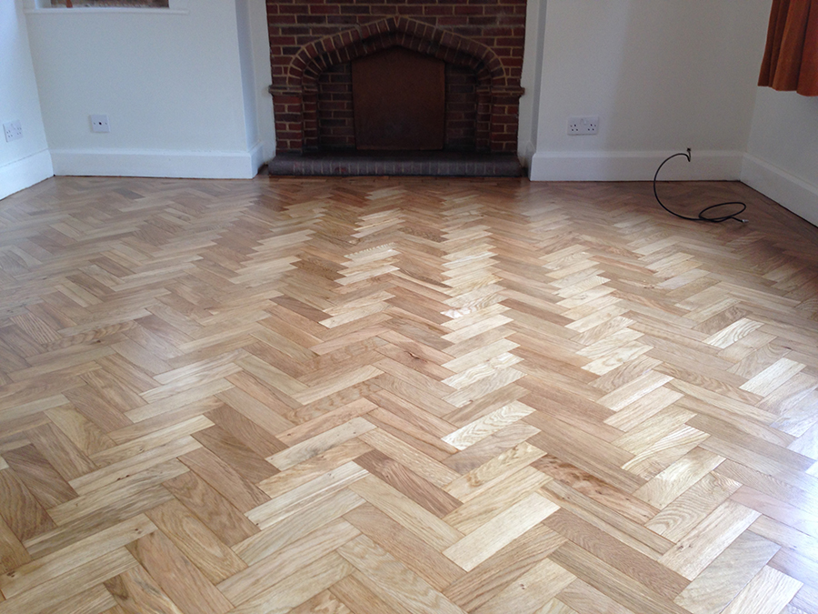 Repaired oak parquet floor blocks re glued