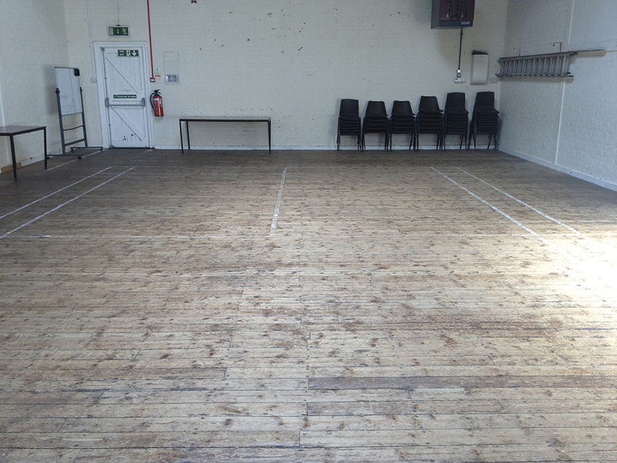 Close up view of floor damage to old floor.