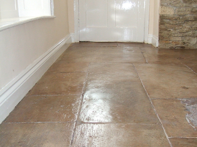 Old Cotswold flagstone floor cleaned grouted and polished