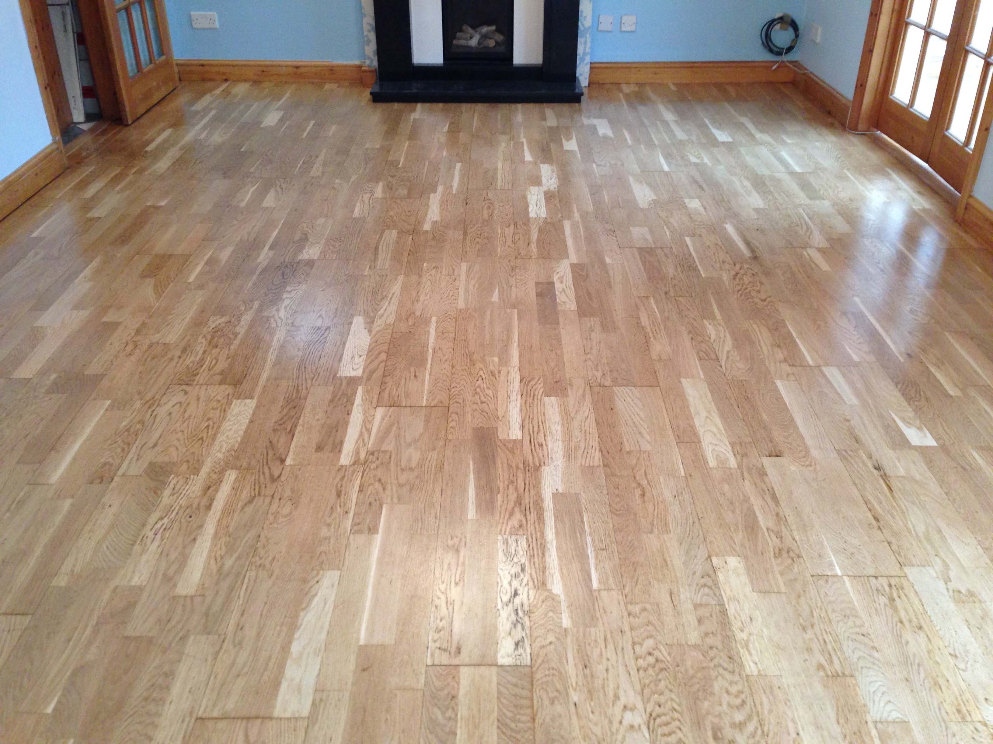 laminated wood floor repaired sanded and varnished