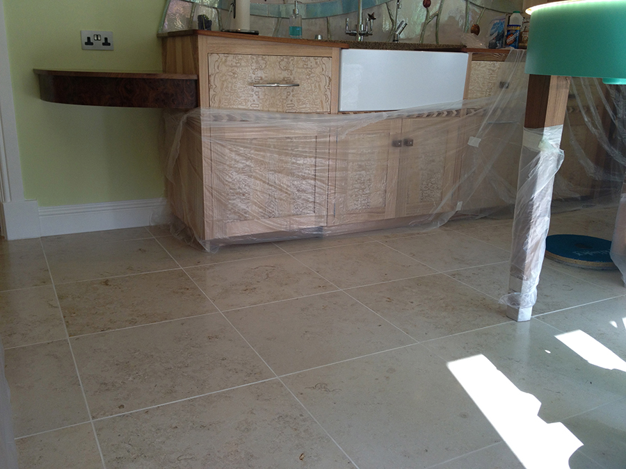 Limestone floor stained with grout