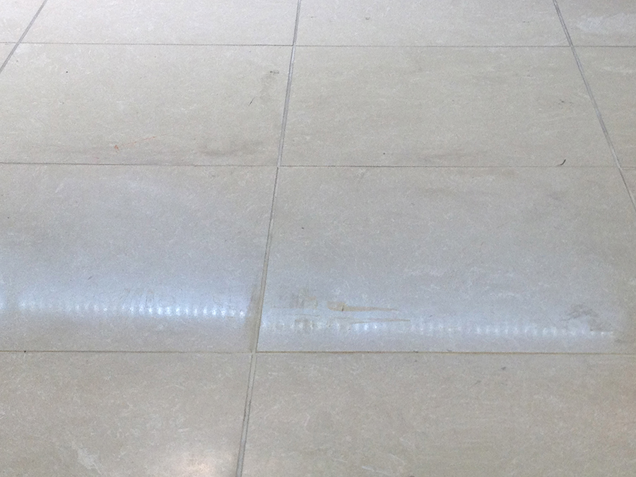 Grout stained marble composite floor tiles