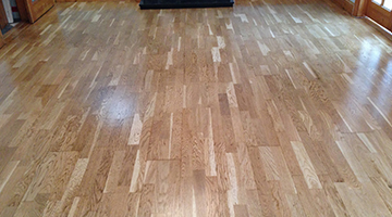 A sanded and lacquered laminate floor in a dining room 