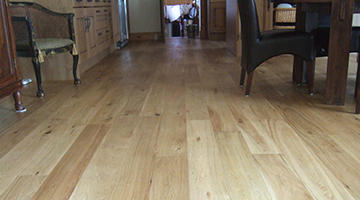 Oak floorboards in a kitchen after sanding and sealing