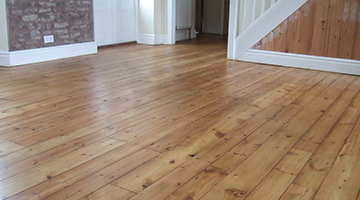 Pine floor in a hallway sanded and varnished