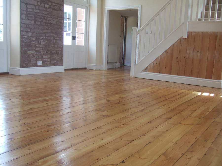 Pine floorboards in hallway sanded and stained