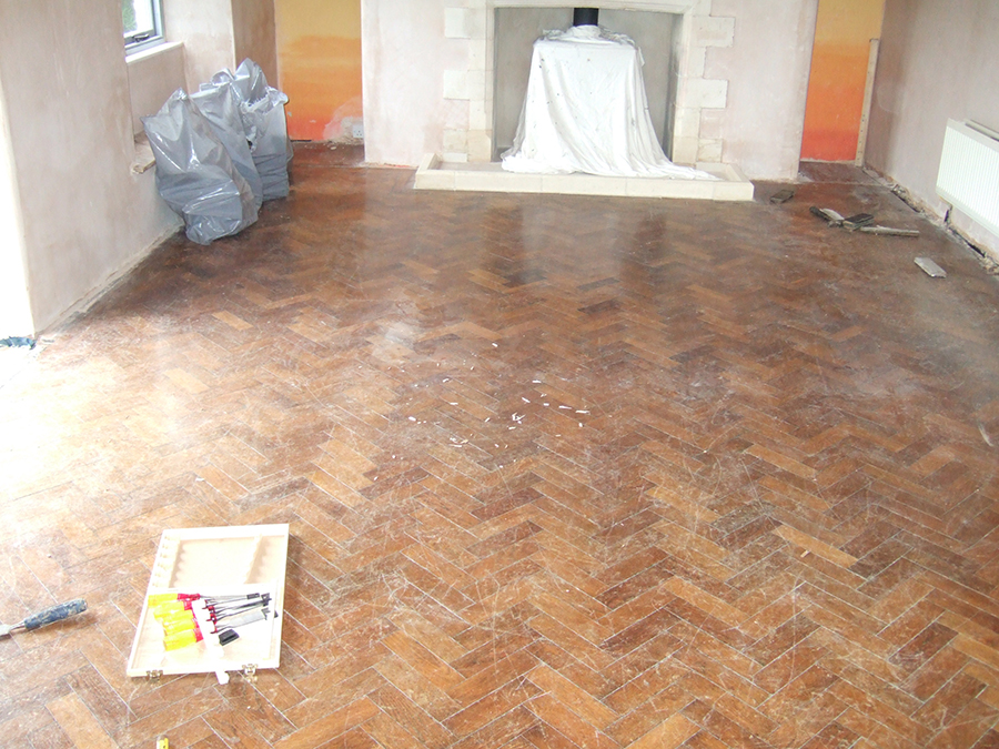 Old pine parquet floor needing repair