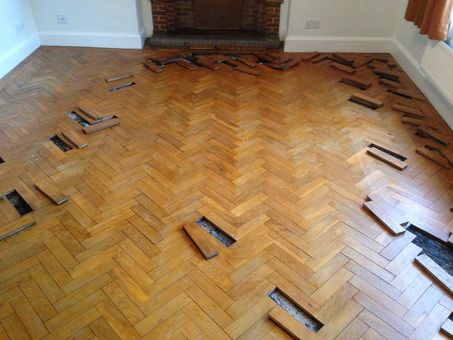 Oak parquet floor with loose blocks