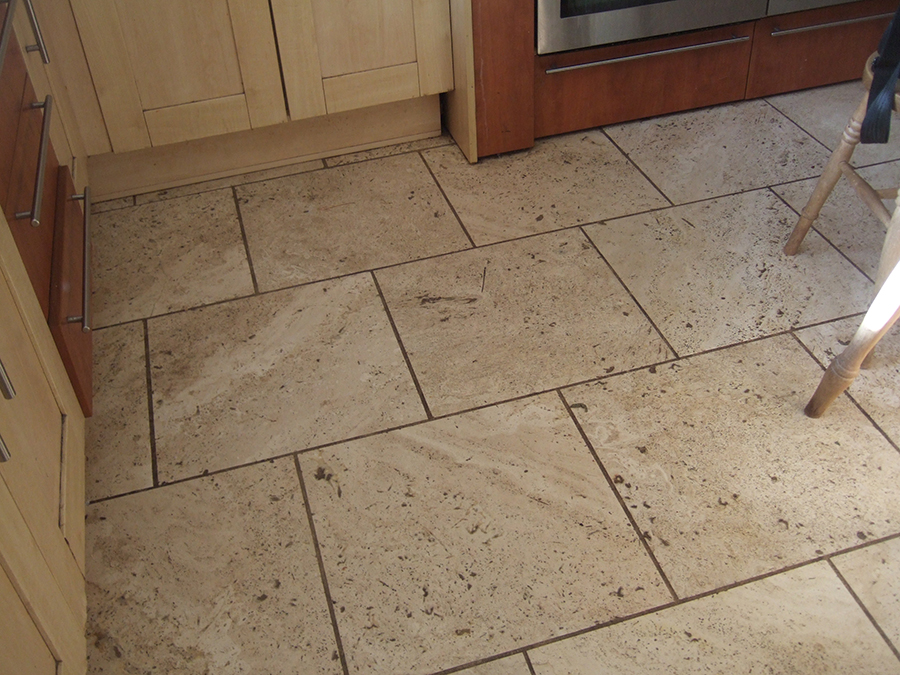 Stained and pitted travertine floor