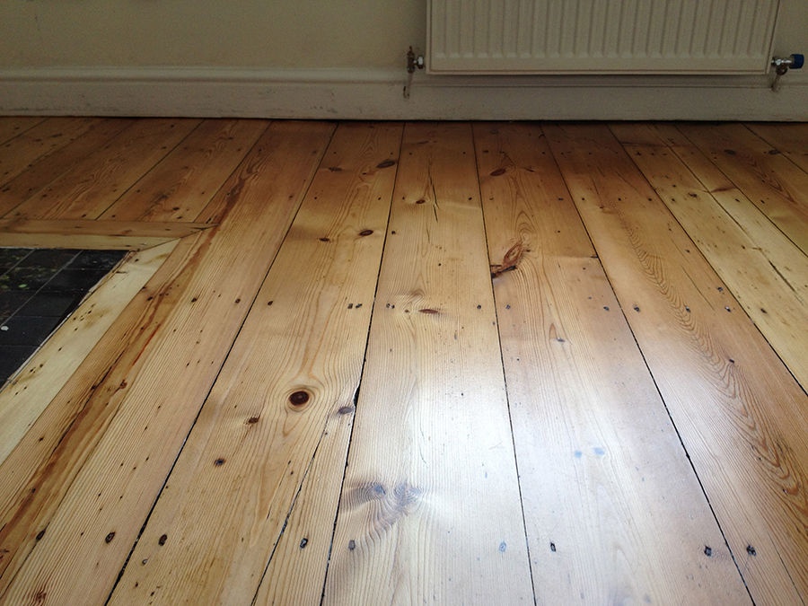 Sanding errors removed from old wood floor 
